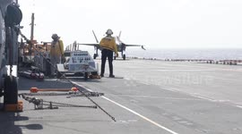 F-35B fighter jets land on USS Tripoli aircraft carrier