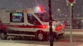 US: Emergency Vehicles Navigate Heavy Wet Snow in Rochester