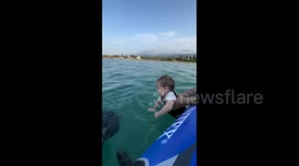 First Time in Ocean Waves: Baby's Hilarious Happy Splashes in Iran!