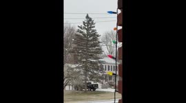 Large snowflakes fall steadily during winter storm in Trumbull, Connecticut, USA