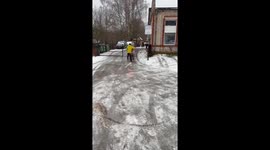 Motorcycle Slides Up Slippery Road