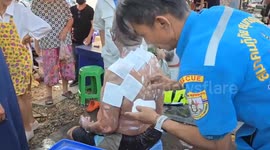 Grandfather severely burned as boiling soup pot tips over at market while buying food