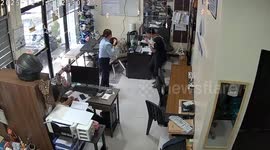 Bench collapses sending colleagues falling to ground