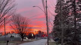 Fiery red sunrise glows above Potsdam, New York