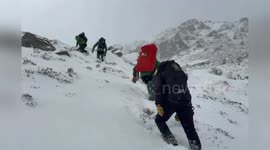Helicopter mountain rescue team saves hikers trapped in avalanche
