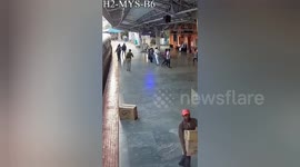 Heroic Rescue: Guard Saves Man from Moving Train in India