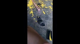 Man cleans up spilled paint in funny mishap in Valencia, Venezuela