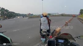 SUV and scooter collide at intersection in Guangdong, China