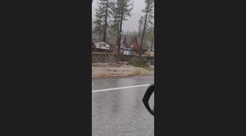 West Wrightwood near flume canyon rd where creek has erroded to nearby homes toppling a power line