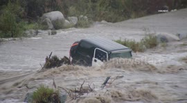 US, Los Angeles: Sunland Jeep Submerged After Getting Stuck In Riverbed