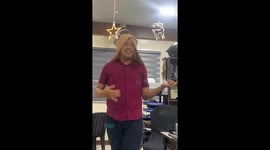 Amusing moment colleague sings and models in front of co-workers