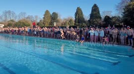 Thrillseekers leap into icy pool during Christmas Day swim in Cheltenham