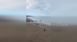 UK: Christmas Day Sea Dip Draws Huge Crowd On Northern Ireland Beach