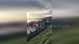 Ireland: Thousands Rush Into Icy Waters As Christmas Tradition Fills Portmarnock Beach