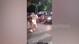 Tourists have punch-up in the middle of road in Thailand
