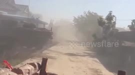 Tanks drive through village as they hit homes 'used as human shields' by Cambodian rebels