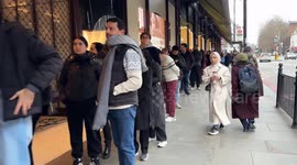 Long queue outside Harrods store in Knightsbridge, London as people rush to shop for Boxing Day sales
