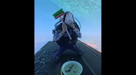Masked Diver Cleaning Ship Bottom
