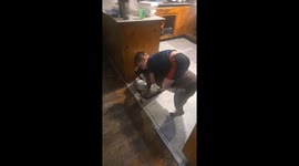 Toddler hugs dog while drinking water in Florida, USA