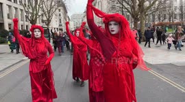XR Rhythms and Red Rebel Brigade march through central London