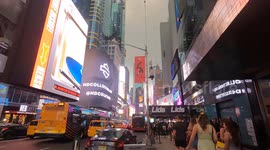 NYC Urban Street at Dusk – Cars, Pedestrians and Glowing Signs (Editorial Use)