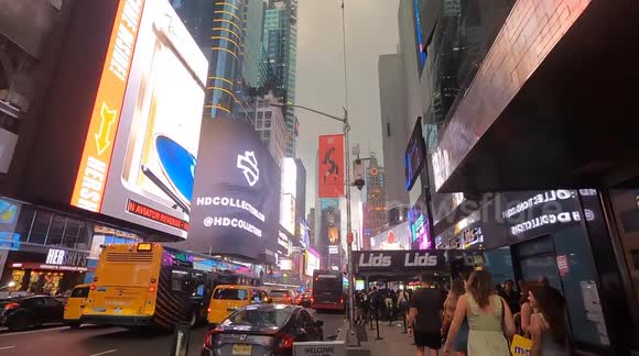 NYC Urban Street at Dusk – Cars, Pedestrians and Glowing Signs (Editorial Use)