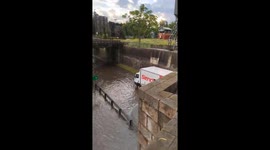 Heavy rain causes flooding and stranded vehicle in Buenos Aires, Argentina