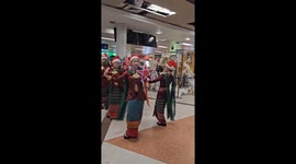 Thai dancers stage Christmas performance for tourists at airport