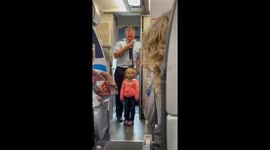 Toddler helps pilot make announcement on flight to New York