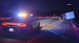 US, Los Angeles: Simi Valley Heavy Winds Flip Semi Trailer On 118 Freeway
