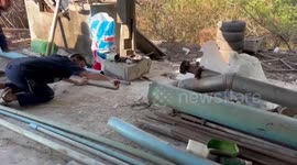 Cobra caught hiding inside long PVC pipe at home