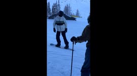 Snowboarder Face Plants After Hitting a Rail