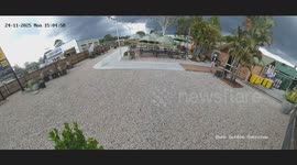 Man Knocked Off His Feet By Flying Umbrellas