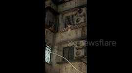Heart-Stopping Moment: Child Rescued from Window Bars in Guangzhou!