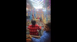 Man struck by metal pole after attempting to jump onto moving fairground ride