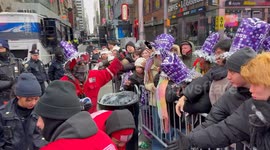 Times Square revelers receive party hats in viewing areas ahead of ball drop
