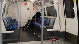 Drunk people in London on the Tube early on New Year's Day