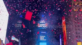 Confetti streams over Times Square as 