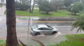 Heavy rainfall triggers street flooding on Ocean Avenue in California, USA