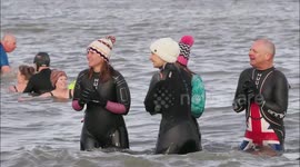 Swimmers brave cold conditions for New Year's Day swim off Kent, UK