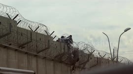 Palestinians risk lives crossing separation wall to reach Jerusalem
