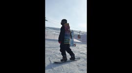Skiing tricks attempt on ice skateboard in Xinjiang, China