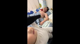 Baby surprises father with playful pinch in Zhejiang, China