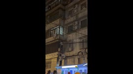Child rescued from building window grill in Shanghai, China