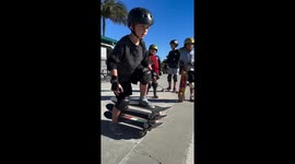 Little Boy Rides 3 Skateboards at the Same Time