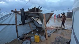 Harsh winter storm floods tents of displaced people in central Gaza