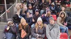 A group of cheerful Americans Revellers greeting 'USA, USA, Happy New Year London' at the London Parade 2026 in England