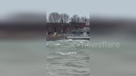 Waves slam into East Bayfront harbour during storm in Toronto