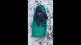 Baby’s First Sled Ride