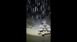 Heavy snowfall blankets garden in Lethen, Scotland, UK